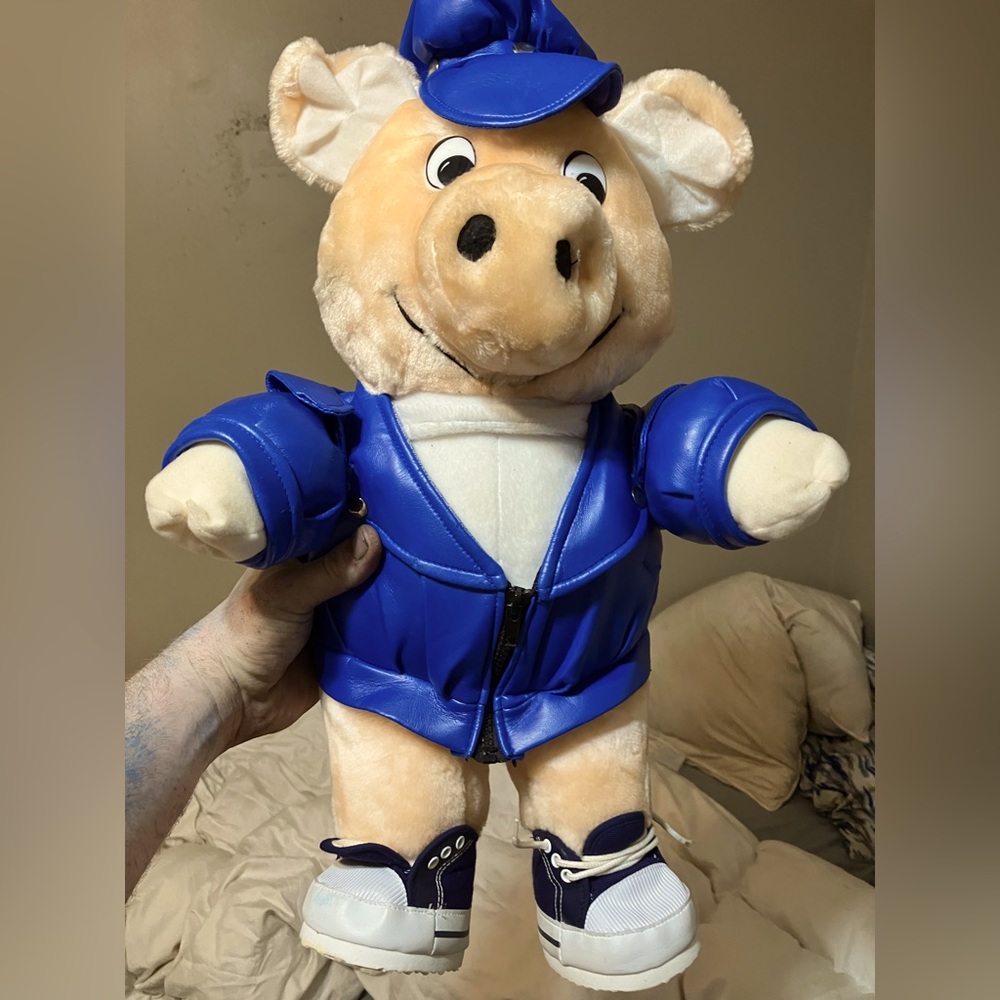 Biker pig with blue faux leather jacket and hat